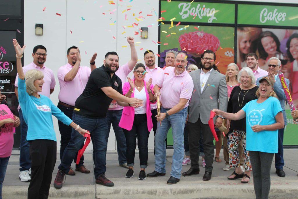 Over the Top staff celebrating outside the San Antonio Central location