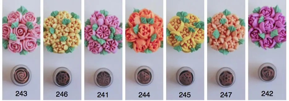 Colorful fondant cupcake toppers with intricate floral and berry designs for cake decorating and pastry embellishments.