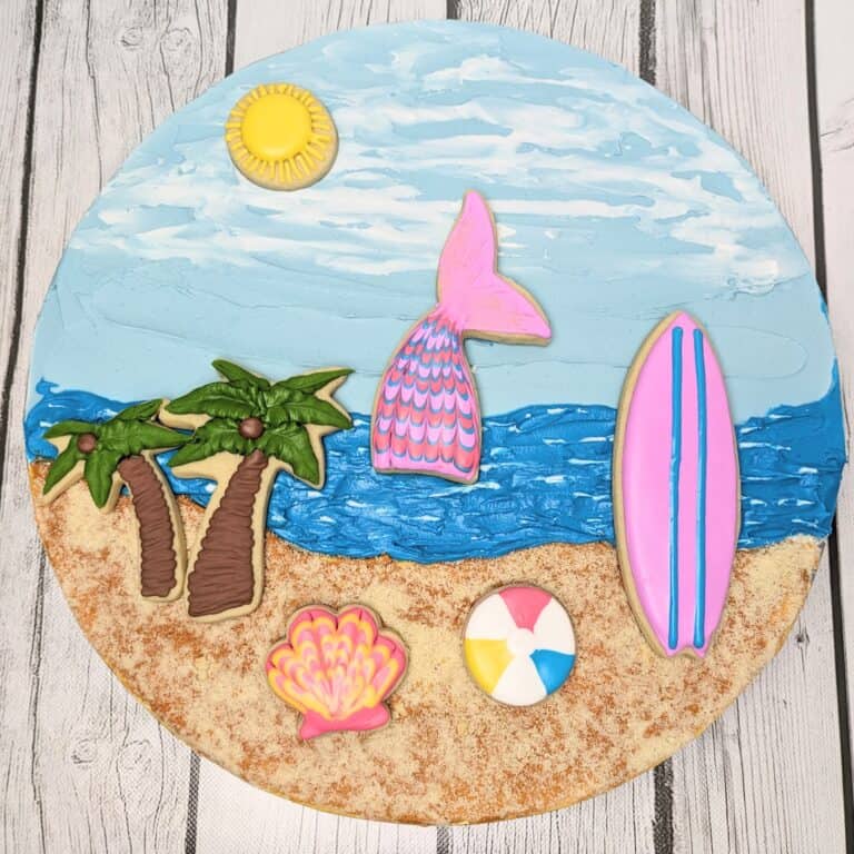 beach scene cookie Beach-themed decorated cookies with tropical designs