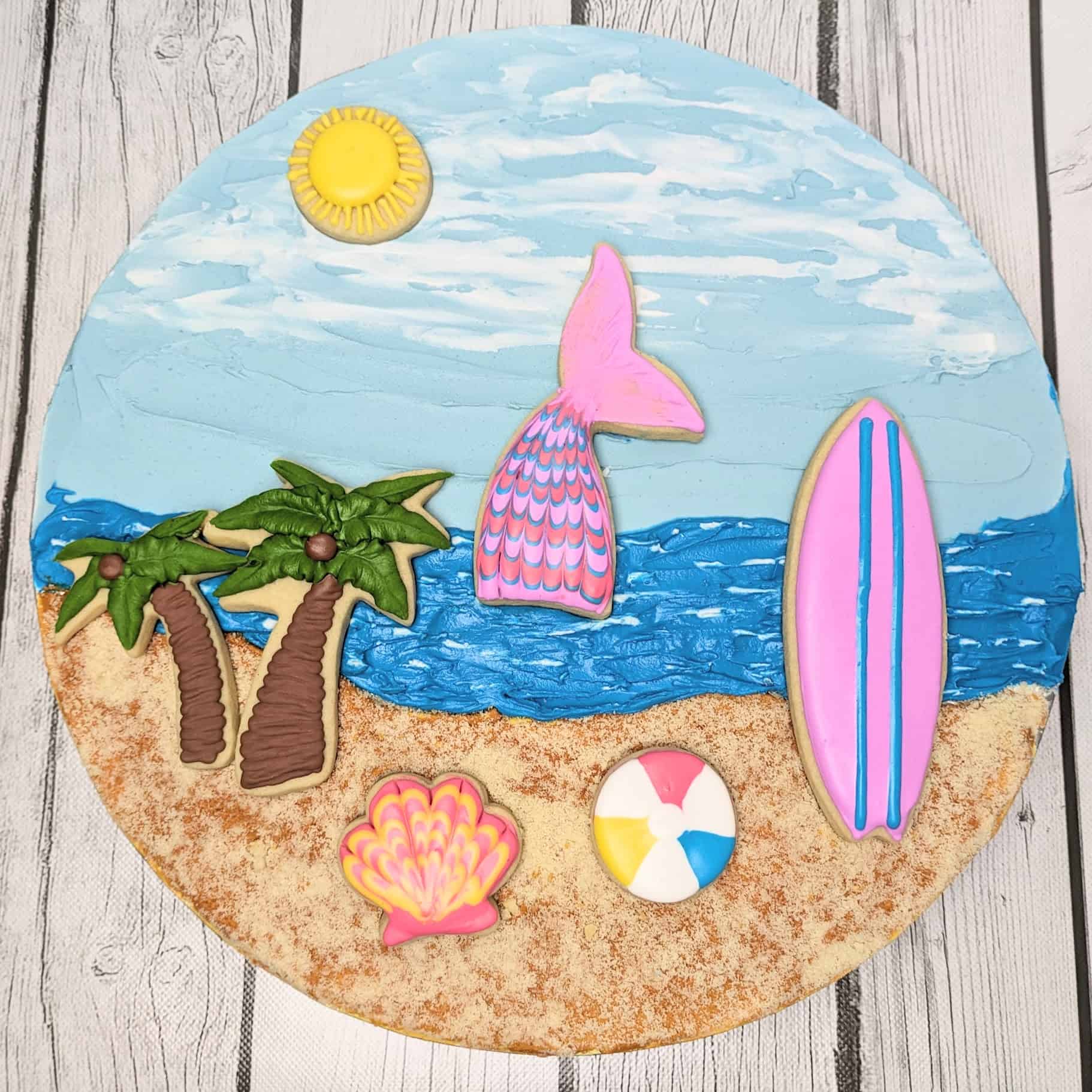 Beach-themed decorated cookies with tropical designs