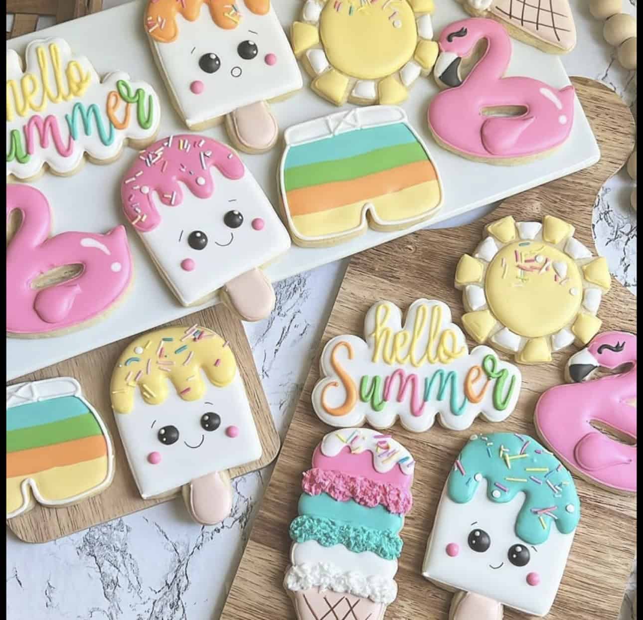 Colorful summer-themed decorated cookies on display.