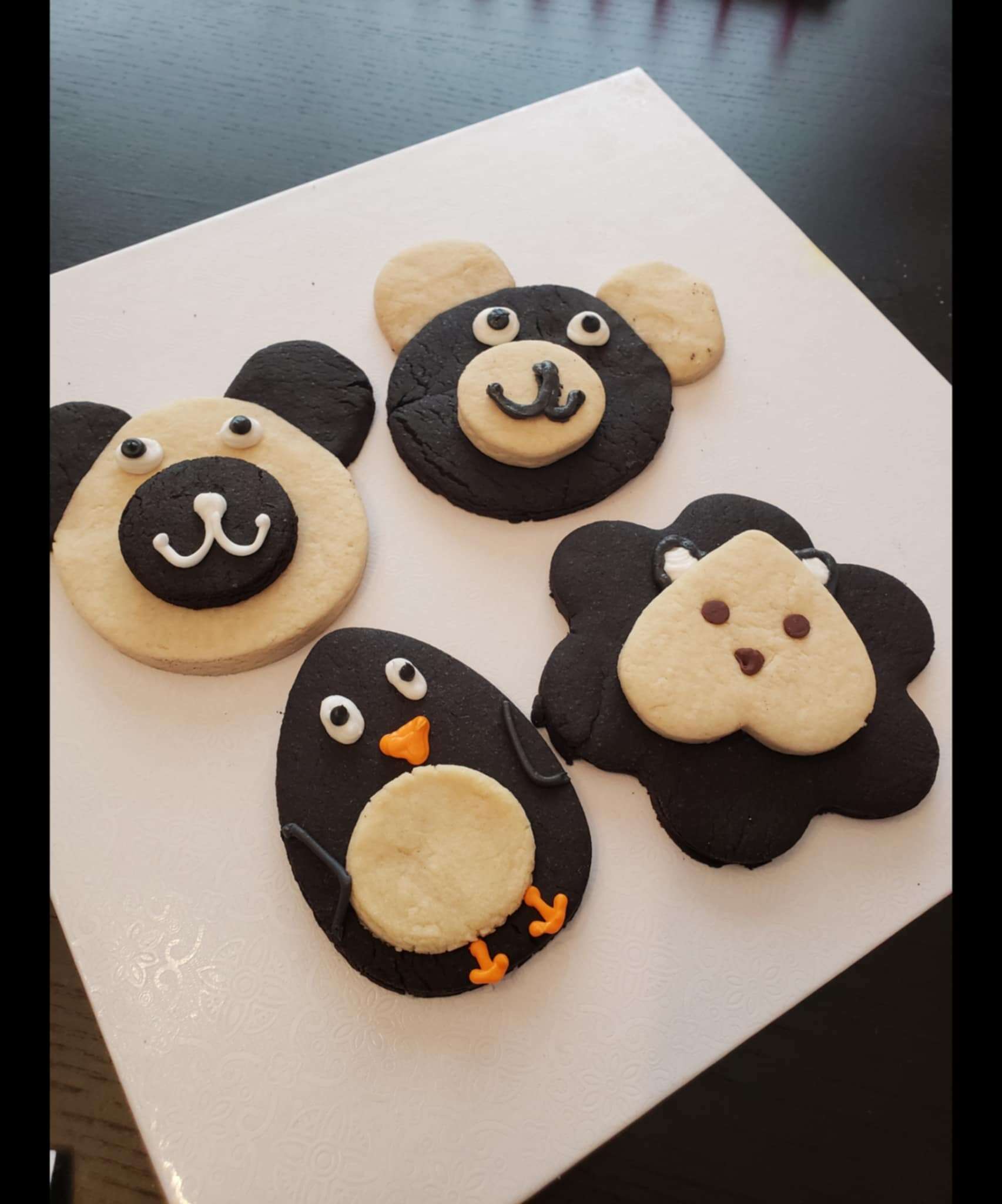 Animal-shaped cookies on white surface.