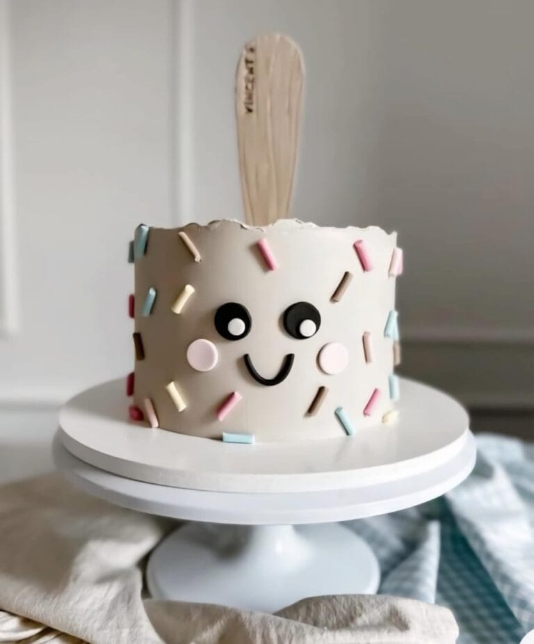 cute popsicle cake Smiling cake with sprinkles and popsicle stick.
