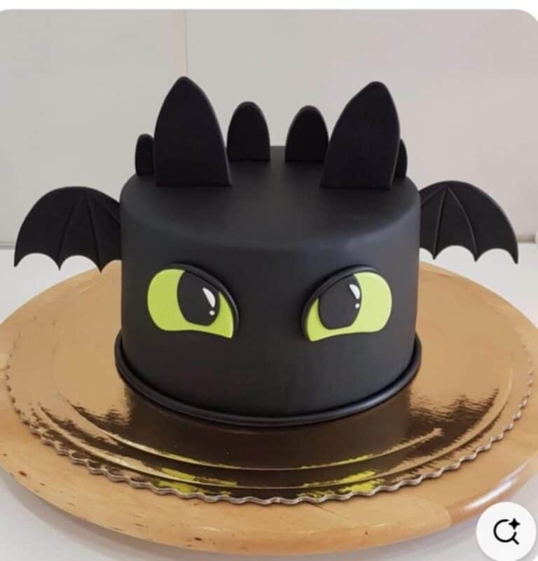 dragon cake Dragon-themed black cake with green eyes.