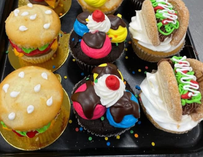 foodie cupcakes Colorful burger and hotdog cupcakes on display.