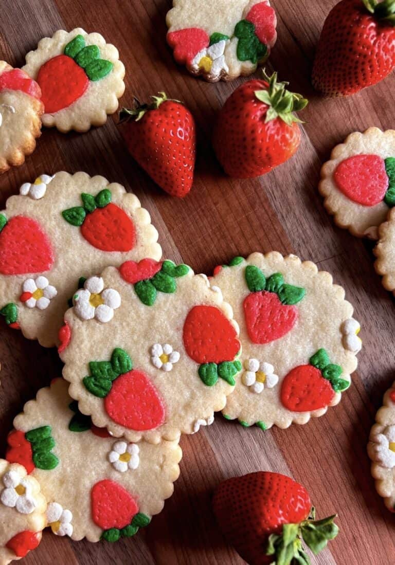 img 4947 Strawberry cookies with real strawberries on wooden surface.