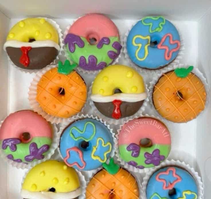 Colorful sea-themed mini donuts in a box