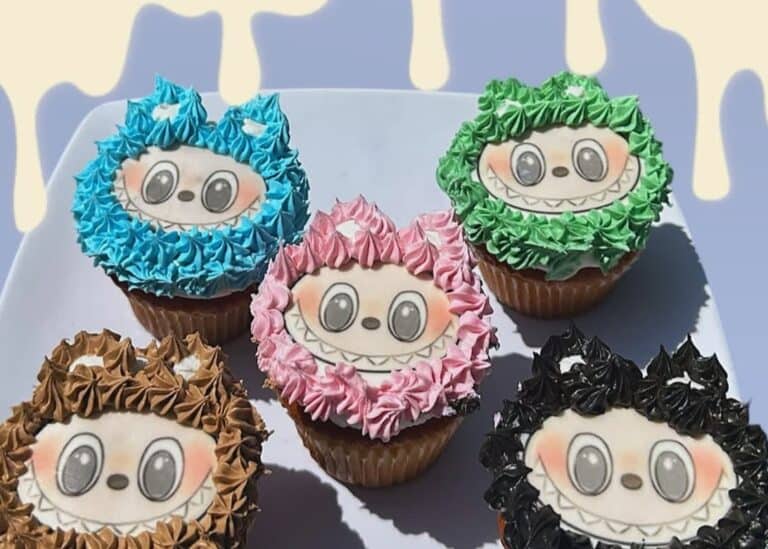 labubu cupcakes Colorful monster-themed cupcakes on a white plate.