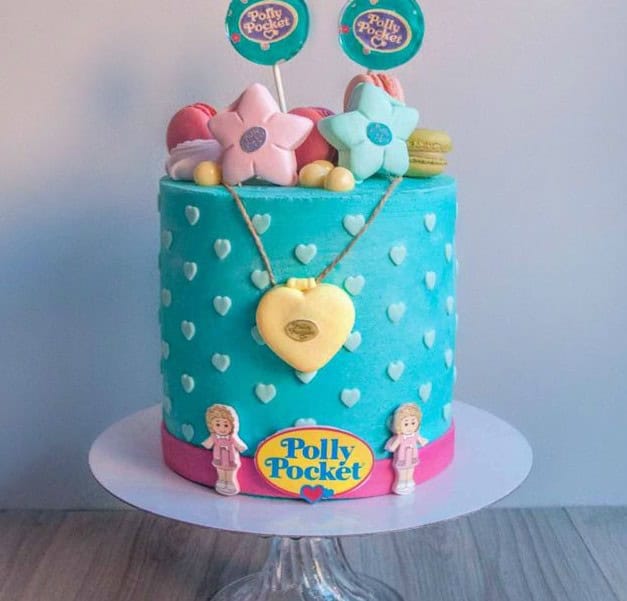 polly pocket cake Polly Pocket themed cake with colorful decorations.