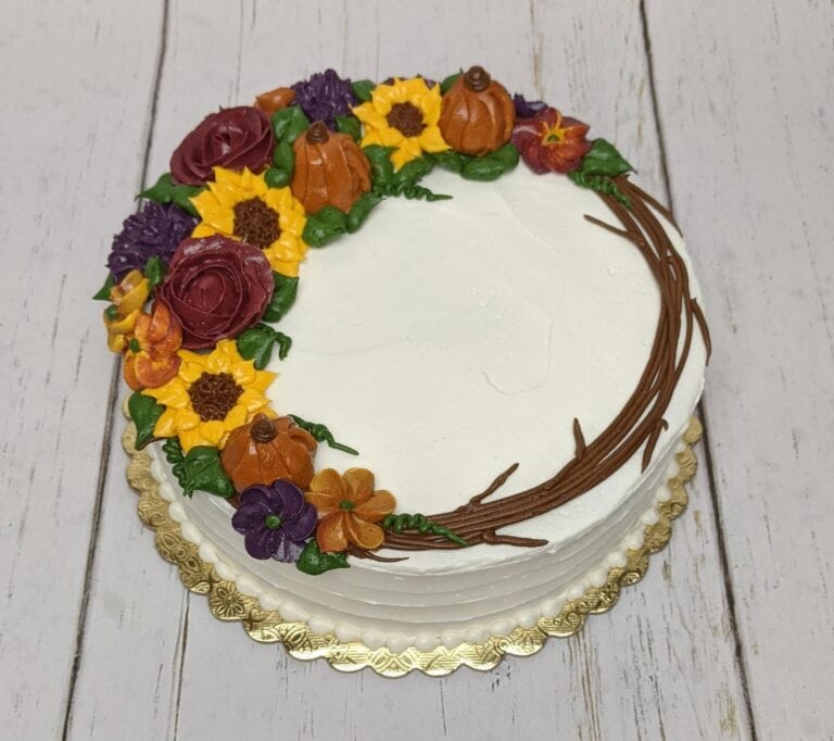 fall buttercream floral wreath Decorated cake with autumn floral design