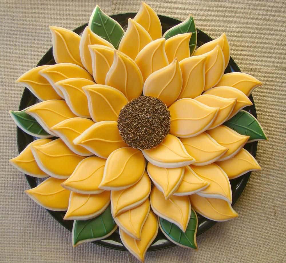 Sunflower-shaped cookies with yellow petals and seeds.