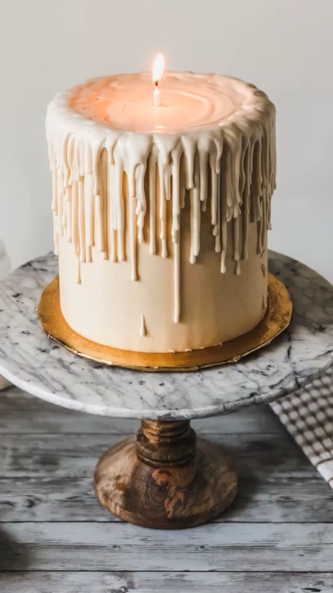 Luxurious white drip cake with elegant dessert decoration, ideal for special celebrations and cake decorating supplies from Over the Top Cake Supplies.