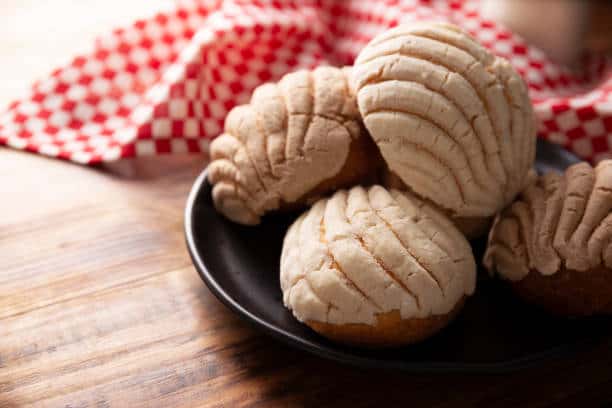 concha Conchas. Mexican sweet bread roll with seashell-like appearance, Usually eaten with coffee or hot chocolate at breakfast or as an afternoon snack.