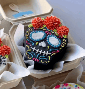Vibrant sugar skull cake decorated for Day of the Dead celebrations, featuring colorful icing, flowers, and intricate details, perfect for festive occasions and themed birthday parties.