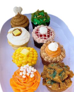Colorful assortment of decorated cupcakes with various themes and flavors, ideal for cake decorating supplies, bakery, and celebration events. Perfect for cake decorating enthusiasts and professionals.