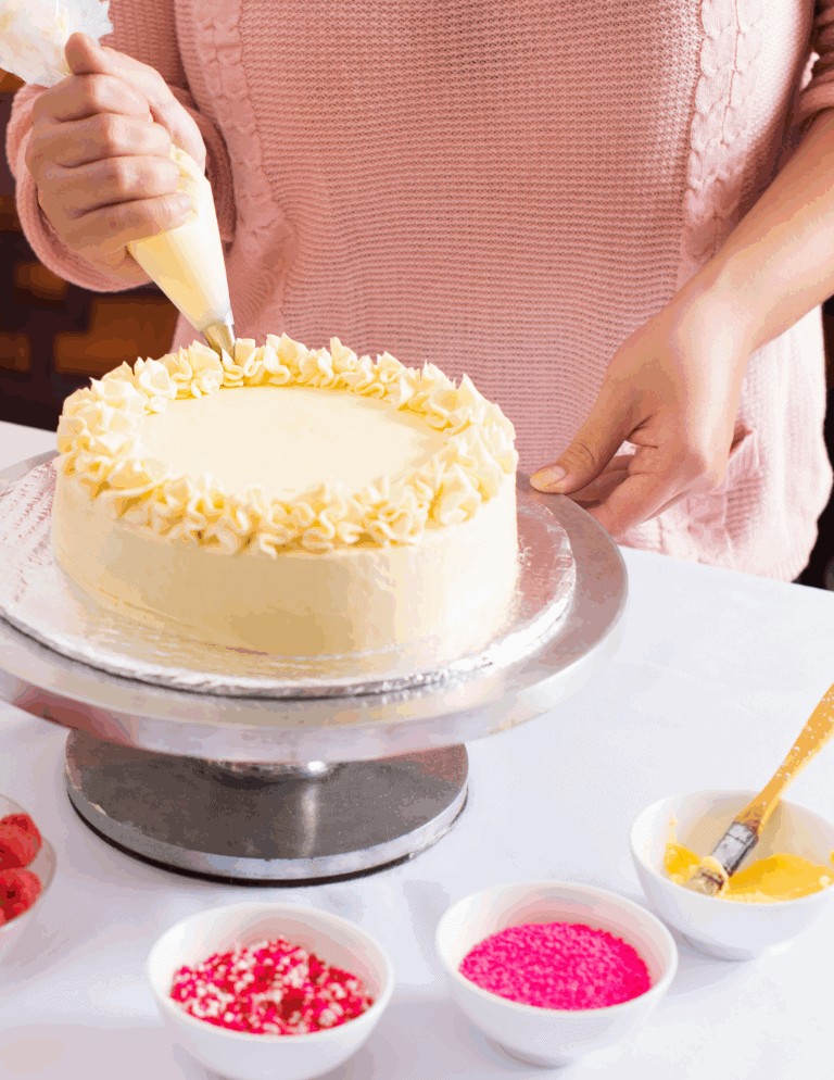 cake decorating Delicious cake decorating with piping bag and frosting at Over the Top Cake Supplies, specializing in professional cake supplies, decorating tools, and edible decorations for bakers.
