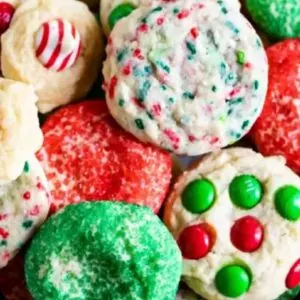 Christmas cookie assortment, holiday cookies with colorful sprinkles and festive decorations, decorated butter cookies, sugar cookies, cookie gift box, baking supplies, holiday baking, cookie decorating, Christmas treats.