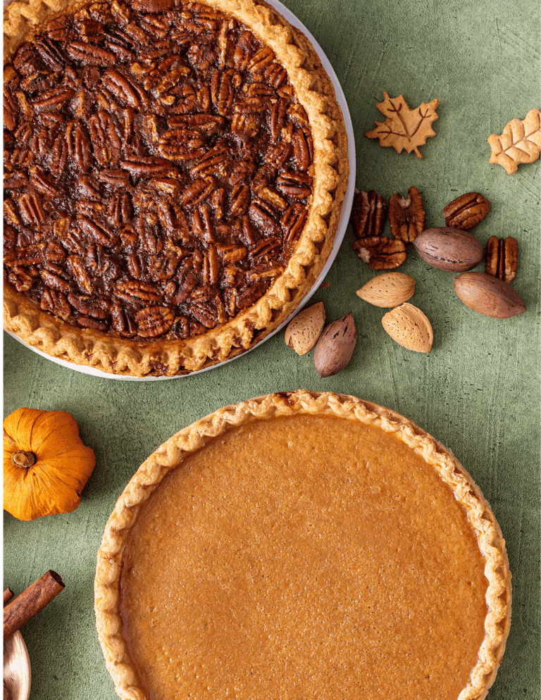 maple pecan and chai Sweet pecan pie with a golden crust and caramelized filling on a rustic green surface. Perfect for holiday desserts and baking needs from Over the Top Cake Supplies.