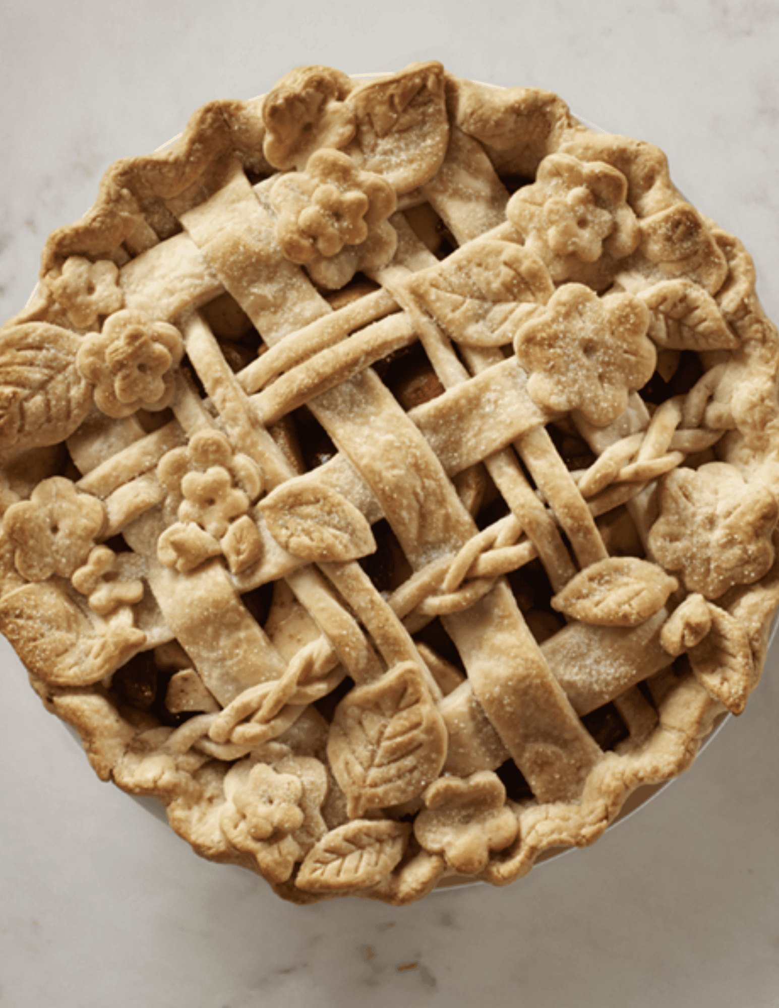 Buttermilk Pie with Lattice Crust and Decorative Flower Edges, baked to golden perfection, perfect for cakes and pastries.