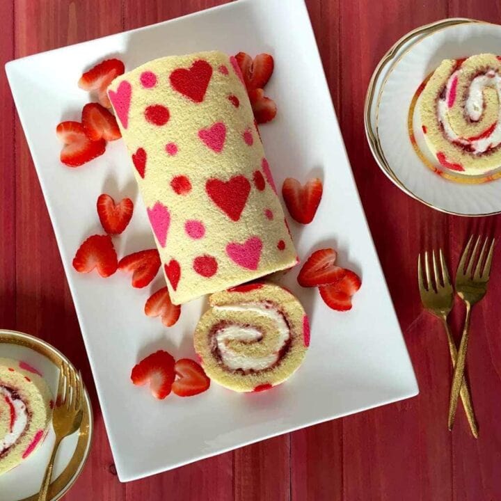Decorative cake roll with heart patterns, perfect for romantic celebrations or special occasions.
