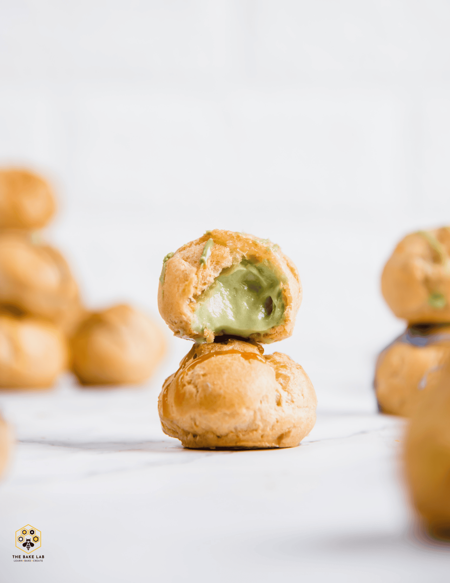 Delicious cream-filled cake pops on white background; perfect for bakery supplies, cake decorating, and dessert tables.