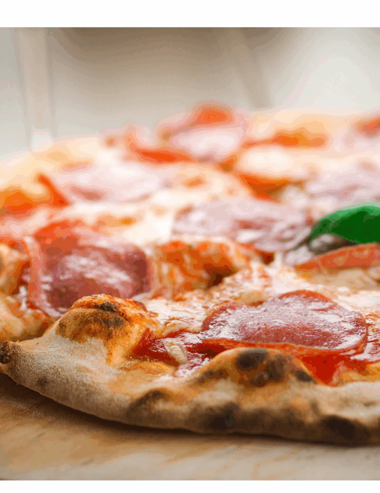 Freshly baked pizza with melted cheese, pepperoni, and toppings showcasing professional pizza baking supplies from Over the Top Cake Supplies. Perfect for pizza enthusiasts and bakers seeking quality ingredients.