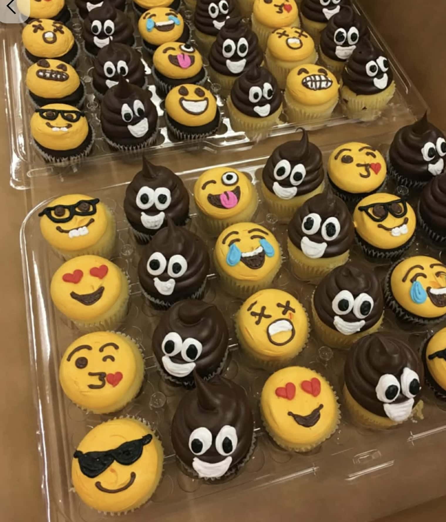 Colorful emoji-themed cupcakes with yellow and chocolate frosting decorated with expressive fondant emojis. Perfect for parties and celebrations.