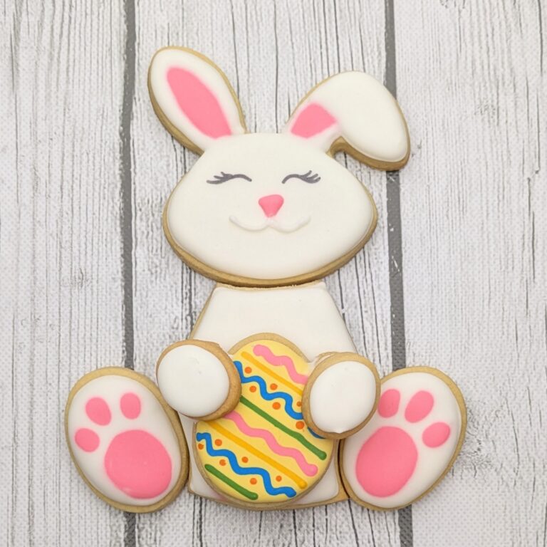 Easter bunny sugar cookie decorated for springtime celebrations. Decorative Easter bunny cookie with detailed icing and colorful Easter egg accents, perfect for spring themed parties and holiday treat platters.