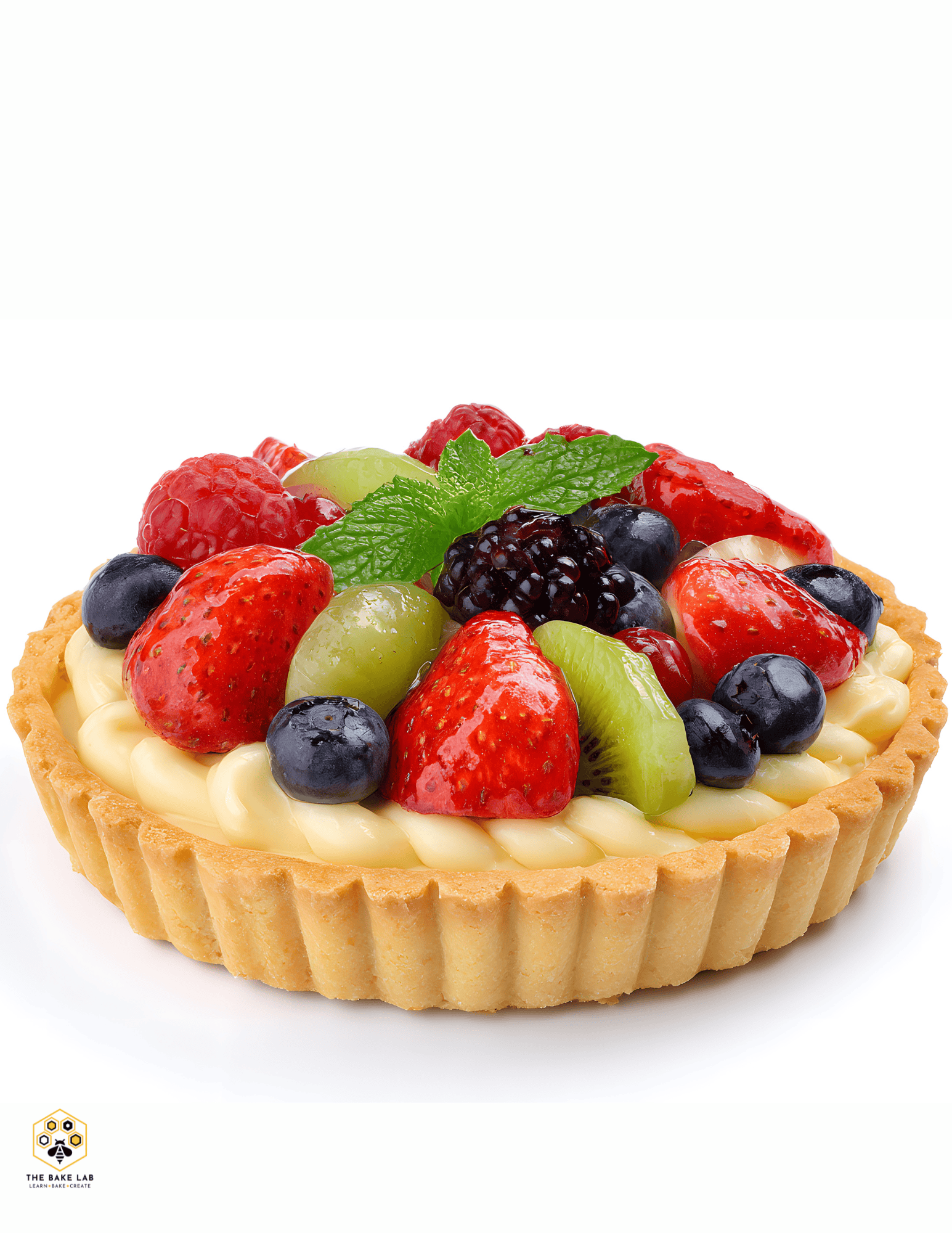 Delicious fruit tart topped with strawberries, blueberries, blackberries, grapes, and fresh mint, perfect for cakes, desserts, and baking supplies at Over the Top Cake Supplies.
