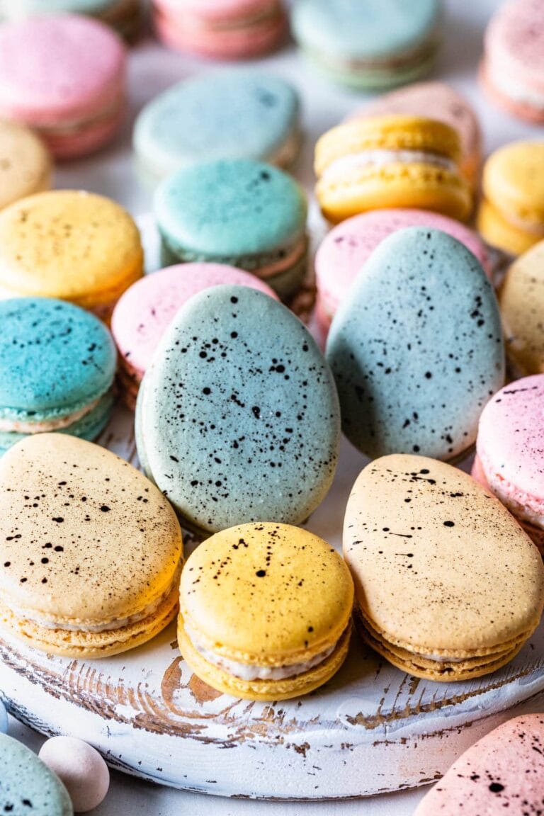 Vibrant pastel macarons on a decorative tray, perfect for cake decorating, baking supplies, and party treats. Great for creating stunning desserts and cake toppers.