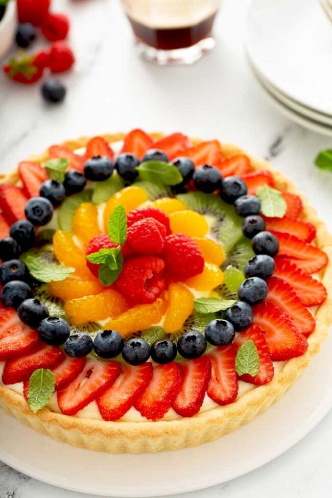 Fresh Fruit Tart Vibrant fresh fruit tart with colorful berries, kiwi, and citrus slices, perfect for dessert or special occasions.