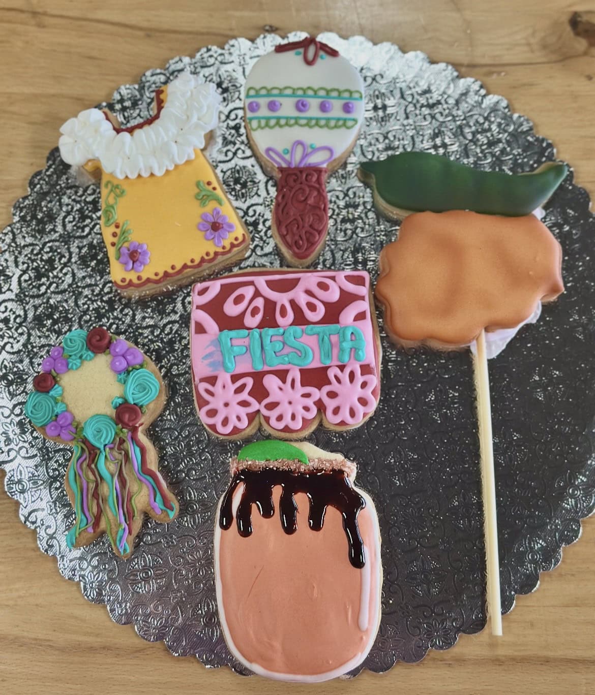 Decorative Fiesta cookies with vibrant colors and themed designs for cake decorating and baking supplies.