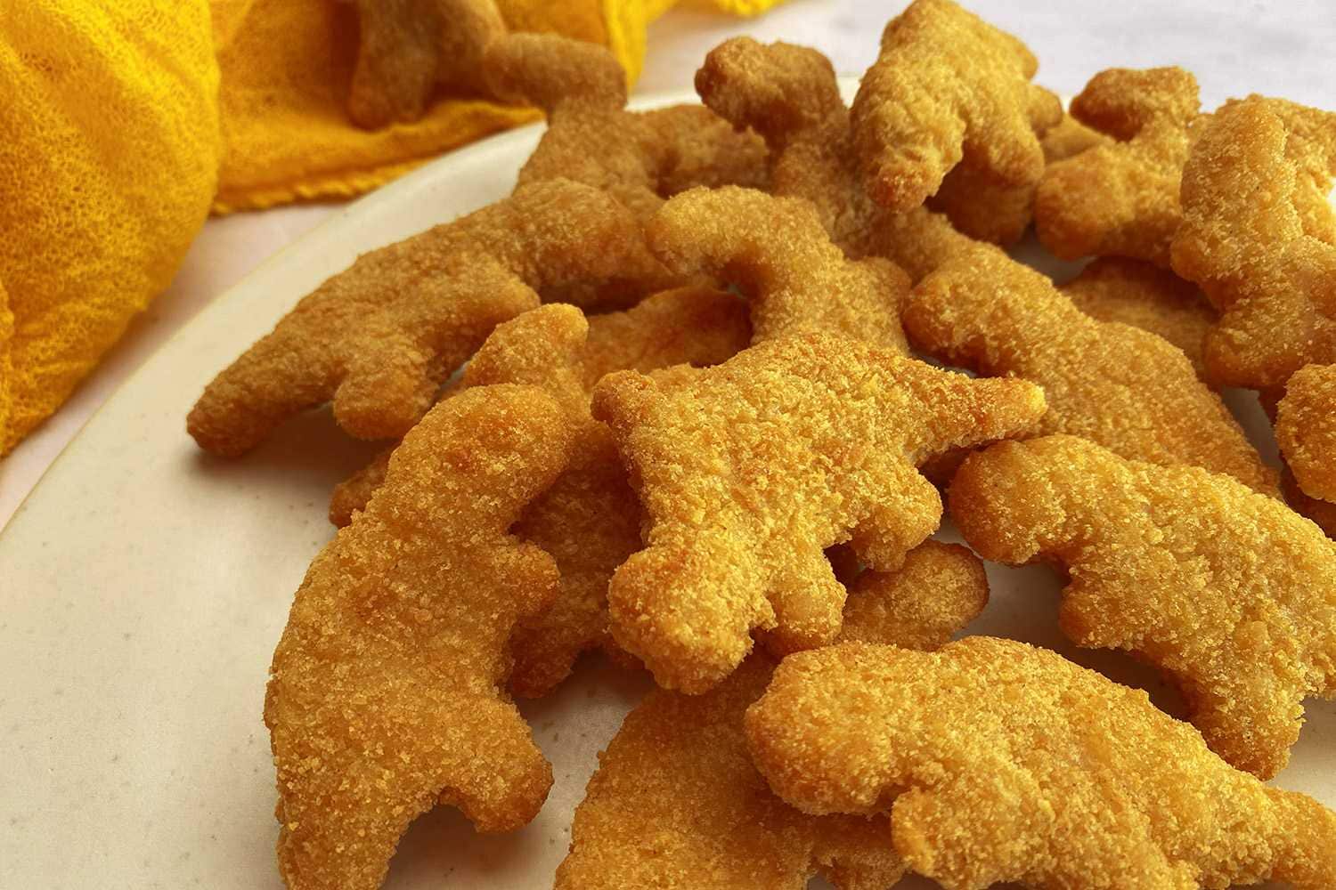 Delicious homemade dinosaur-shaped chicken nuggets perfect for kids' meals and parties. Made with fresh ingredients, these crispy dino nuggets are fun and easy to prepare.