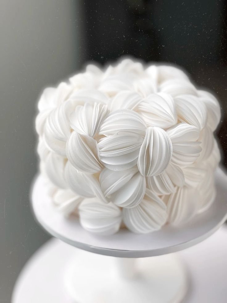 Elegant Wafer Paper Cake for Special Occasions Beautiful white wafer paper cake with intricate petal details, perfect for weddings and celebrations. Crafted with delicate wafer paper for a stunning decorative effect.