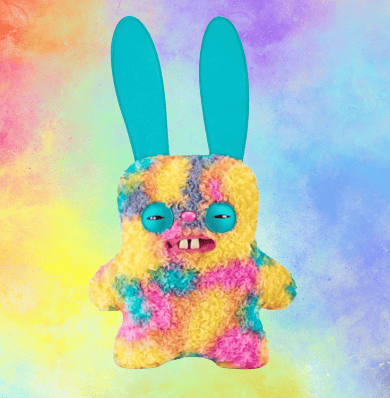 Bright and playful Fugglers cake-shaped plush toy with bunny ears, vibrant rainbow colors, and quirky facial features, perfect for kids' party favors and cake-themed decorations.