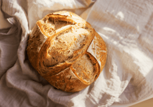 Artisan bread loaf with a golden crust, perfect for baking, cooking, and bread enthusiasts. Ideal for creating delicious homemade bread and bakery-quality treats.