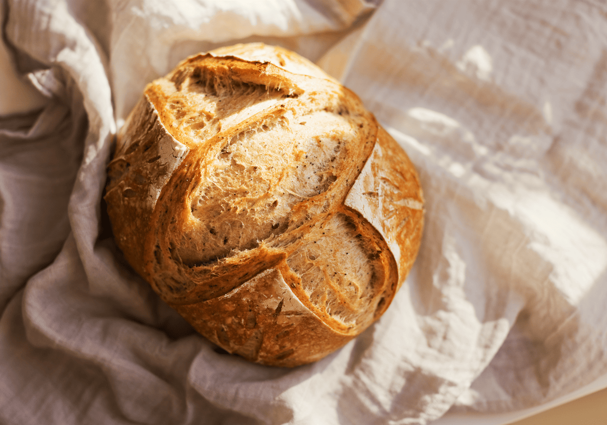 Artisan bread loaf with a golden crust, perfect for baking, cooking, and bread enthusiasts. Ideal for creating delicious homemade bread and bakery-quality treats.