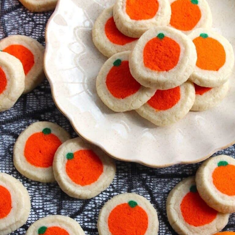Sweet orange-themed cookies with orange and green details, perfect for baking supplies from Over the Top Cake Supplies.