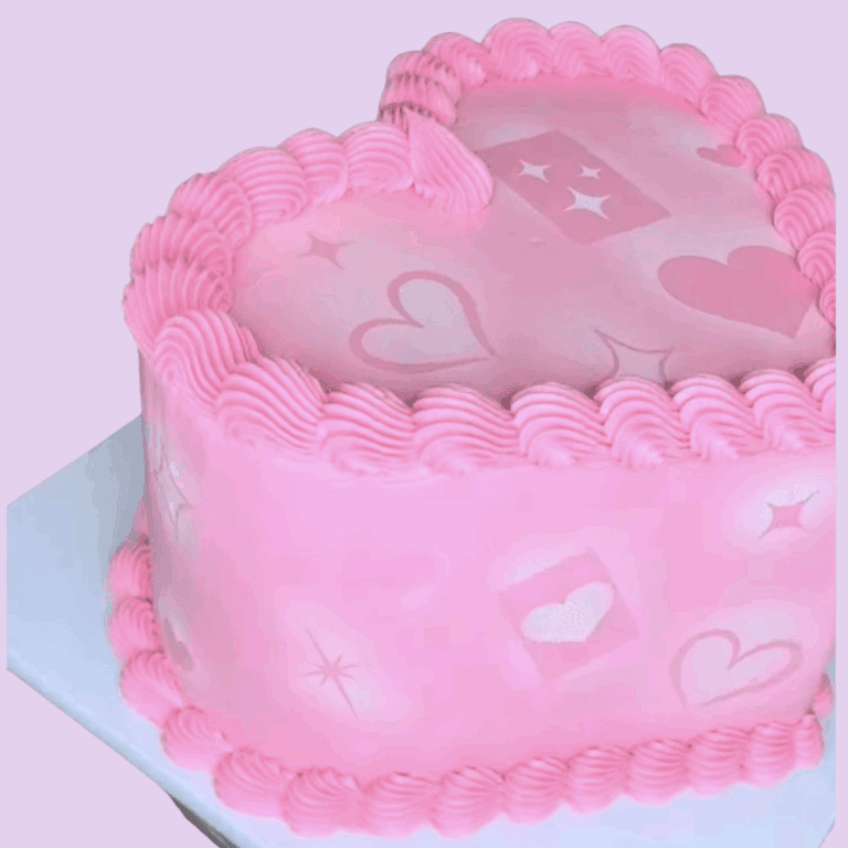 Heart-shaped cake with pink frosting, love-themed decorations, and piping detail, perfect for romantic occasions, wedding, or anniversary celebrations.